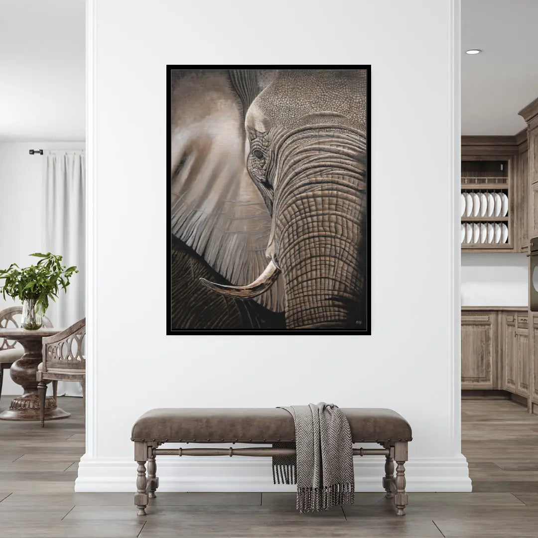 Framed elephant portrait on a wall in a home interior.