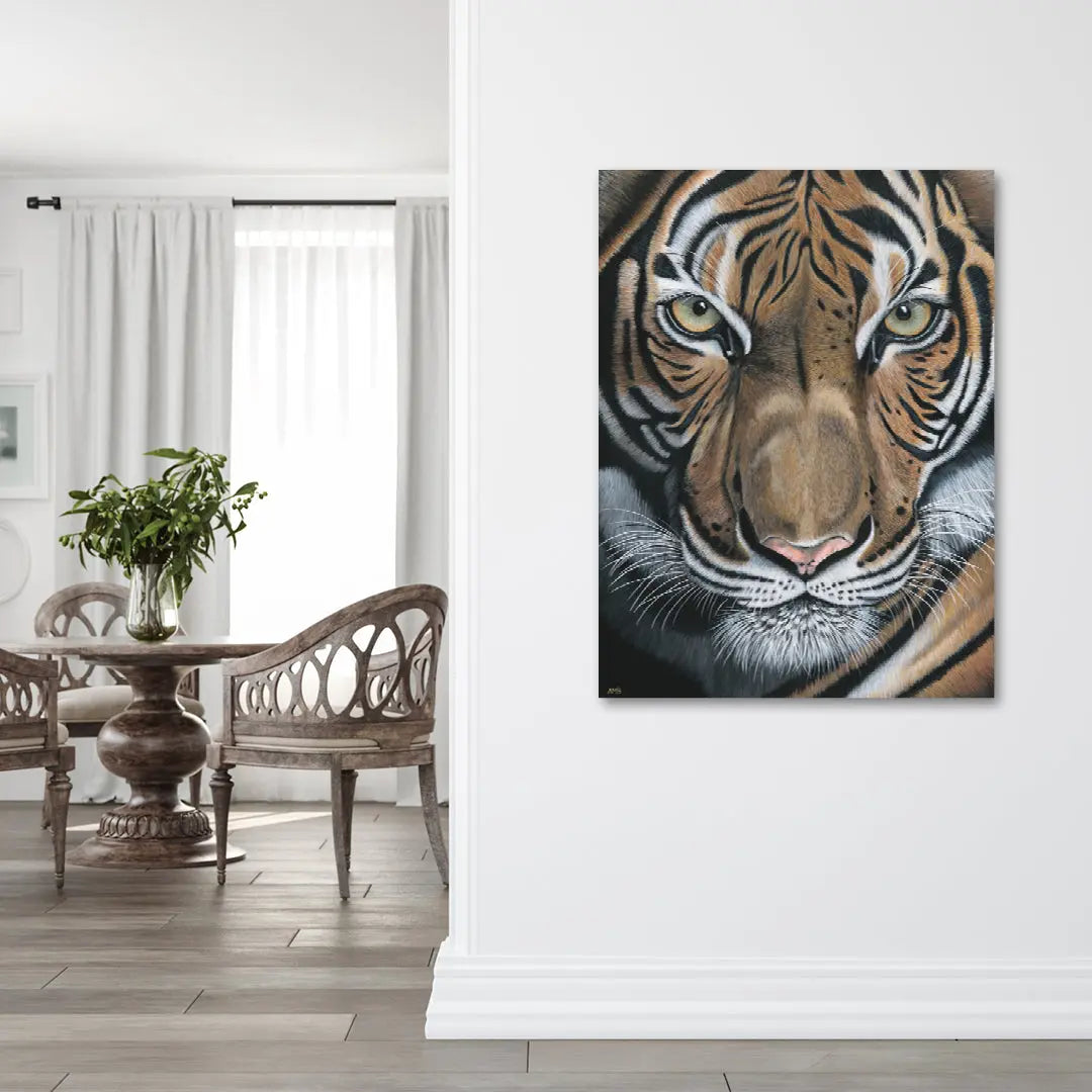 Tiger painting on a wall in a room with a table and chairs.