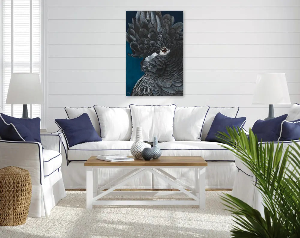 Living room with a white couch, wooden coffee table, and a large bird painting on the wall.