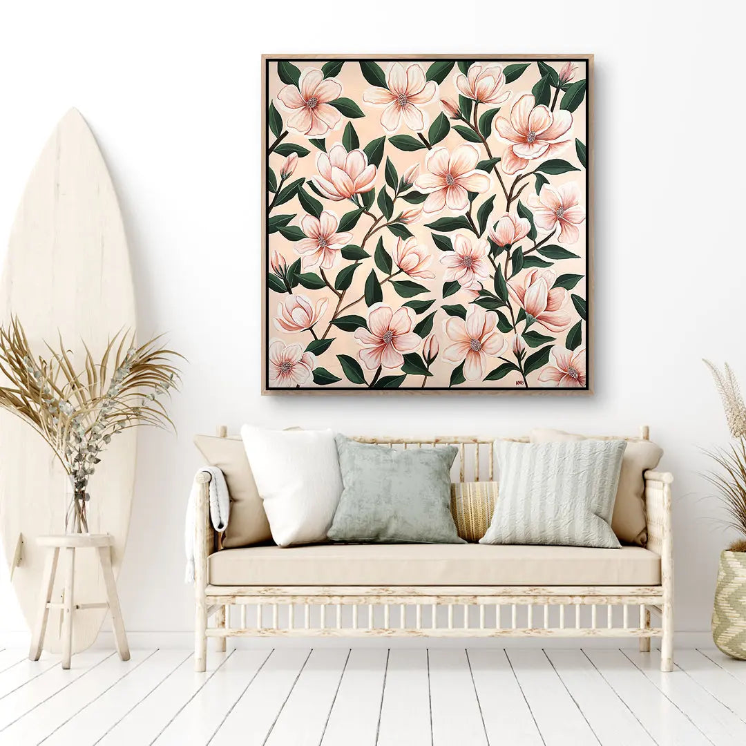 Floral artwork on a wall above a sofa in a living room setting